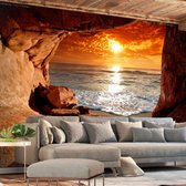 Fotobehangkoning - Behang - Vliesbehang - Fotobehang Uitzicht op Zee vanuit de Grot 3D - Exit from the Cave - 100 x 70 cm